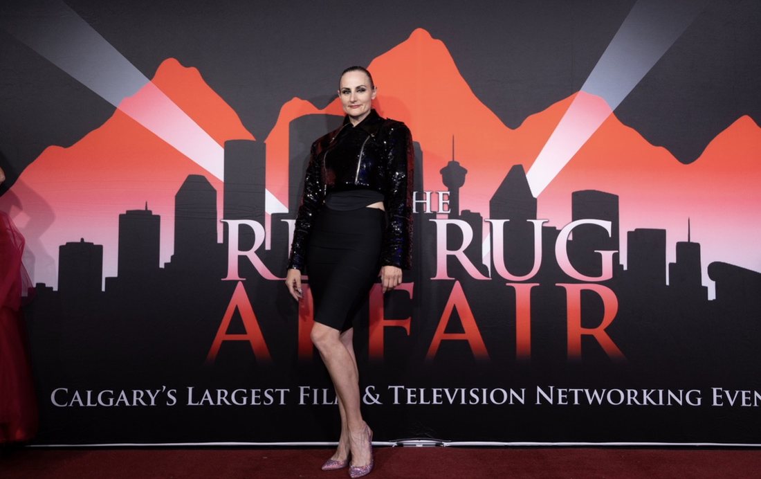 Amanda Hamilton on the step-and-repeat at The Red Rug Affair in Calgary